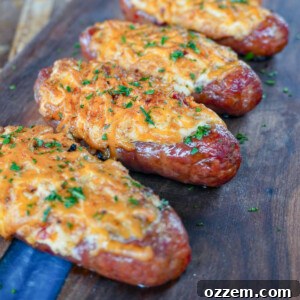 Sausage Popper Boats with a creamy filling and shredded cheese, ready to be cooked or freshly grilled.