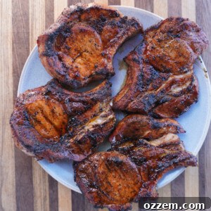 Perfectly Grilled Pork Chops on a plate, ready to be served.