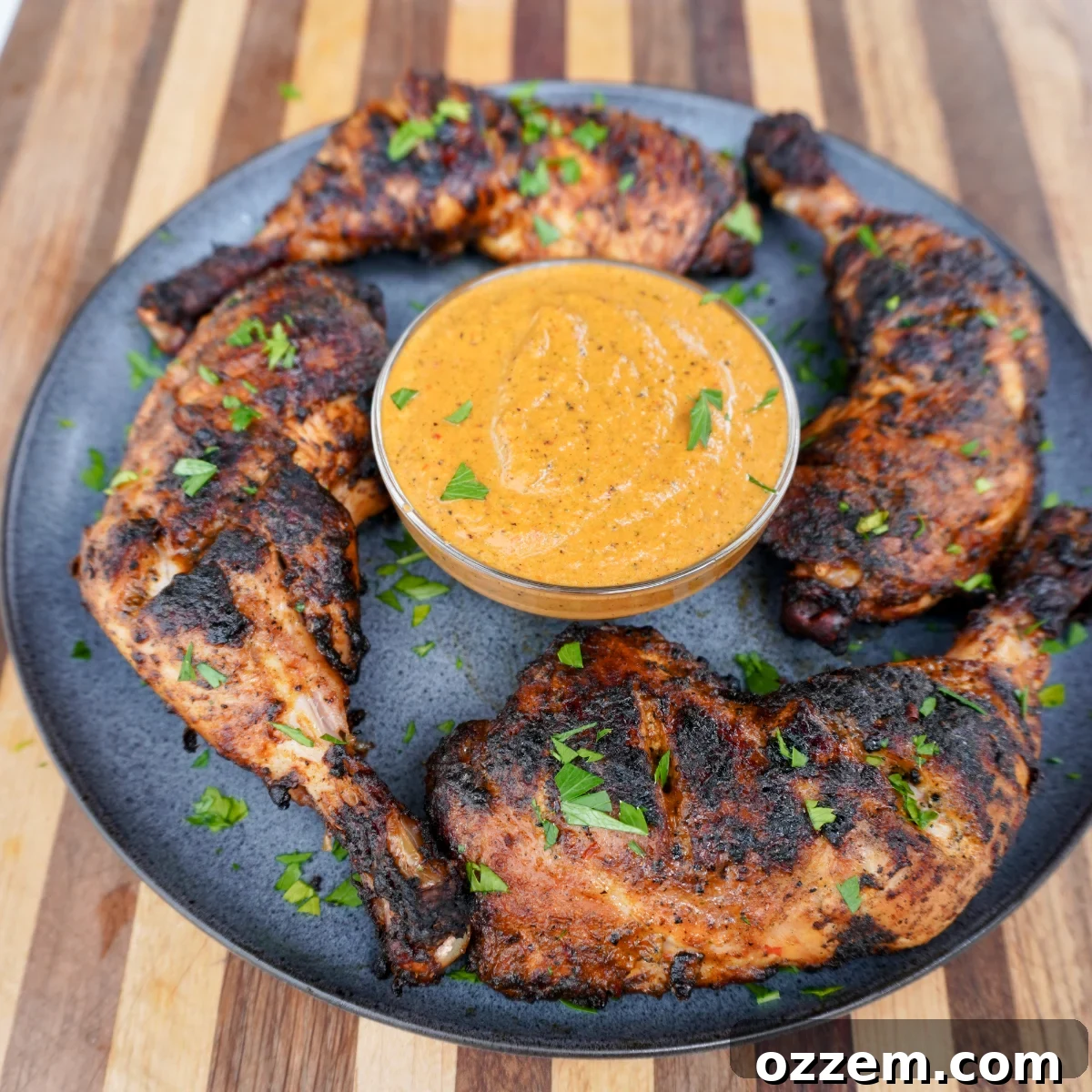 Perfectly grilled Peri Peri Chicken, glistening with sauce and ready to be served.