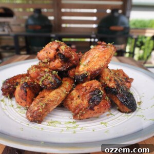 Delicious Honey Lime Chicken Wings stacked on a plate, ready to be served.