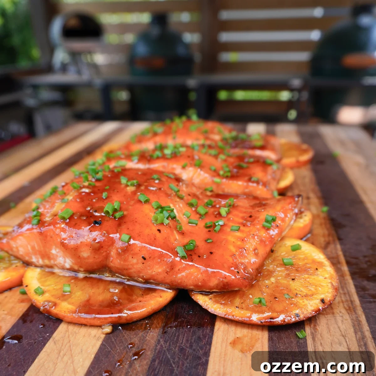 Grilled salmon with zesty maple bourbon glaze on a bed of citrus slices