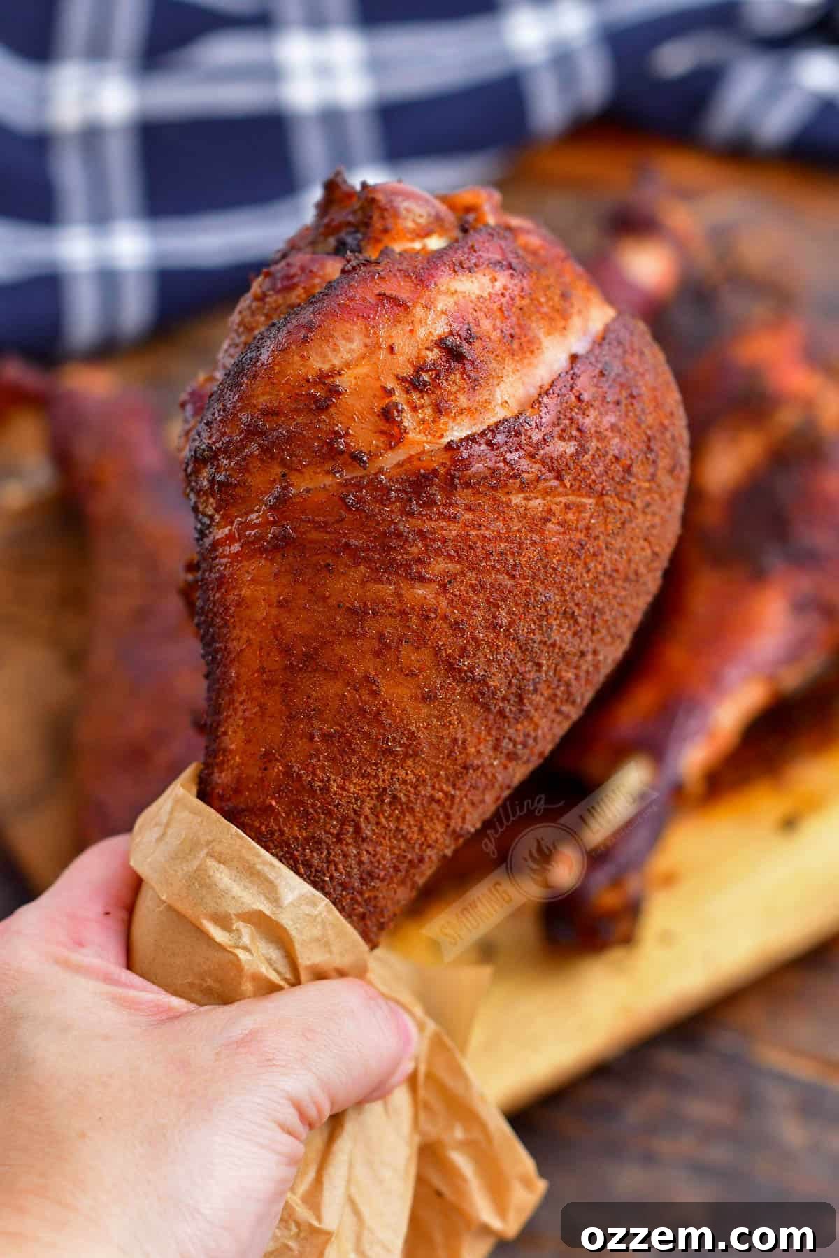 holding a smoked turkey leg
