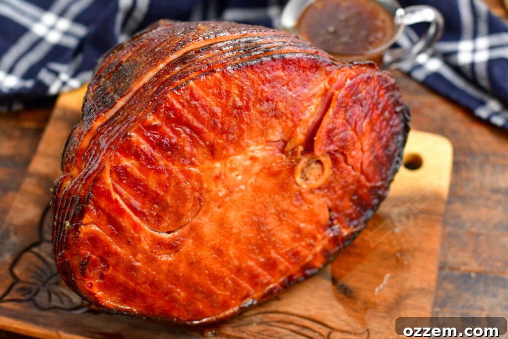 The underside of a perfectly smoked ham resting on a cutting board, showing its rich, even color and indicating thorough cooking.