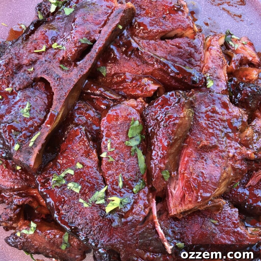 Pitmaster's Smoked Pork Steaks 2 Slow Smoked Pork Steaks on the grill, a hidden gem of barbecue