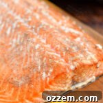 Hot smoked salmon on a wooden cutting board
