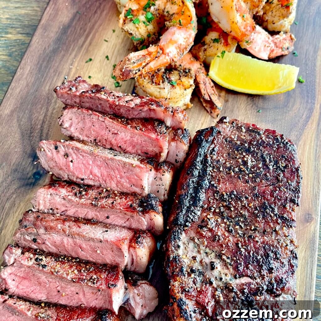 Perfectly grilled New York Strip steak and tiger shrimp for an easy surf and turf meal.