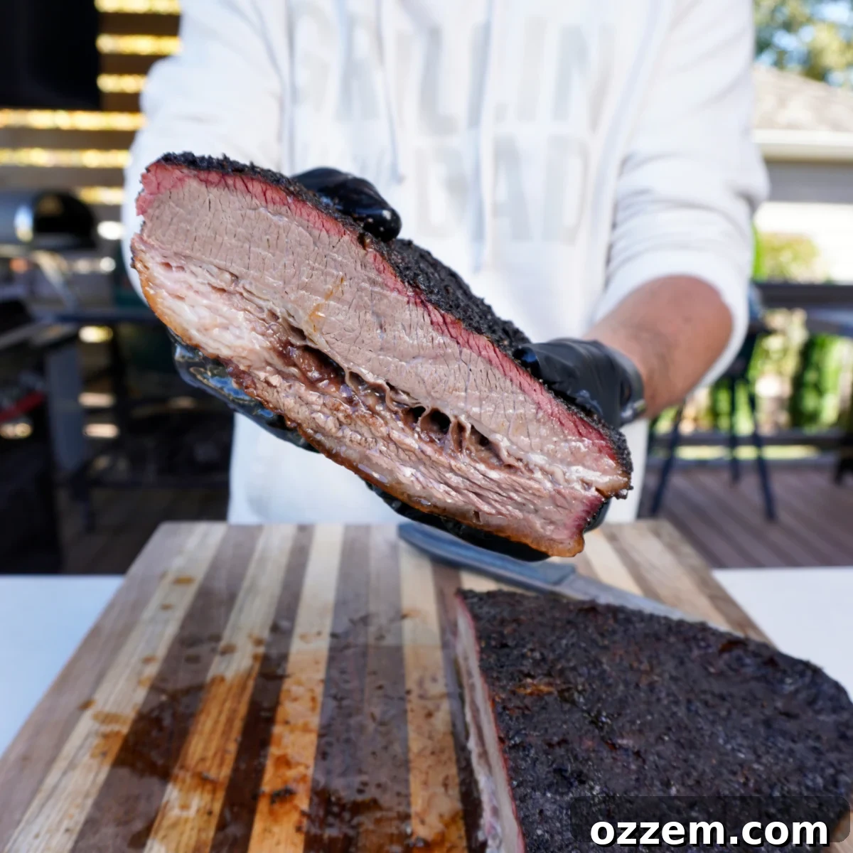 Perfectly smoked brisket, sliced and ready for preparation, showcasing its juicy interior and smoke ring