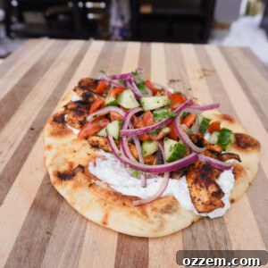 Grilled Chicken Shawarma on a pita, ready to serve.