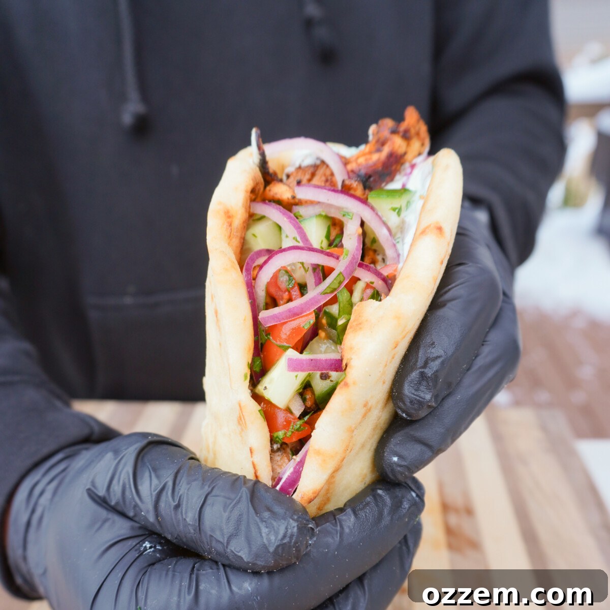 Flame Kissed Chicken Shawarma 10 Grilled chicken shawarma, perfectly wrapped in a pita, ready to be enjoyed.