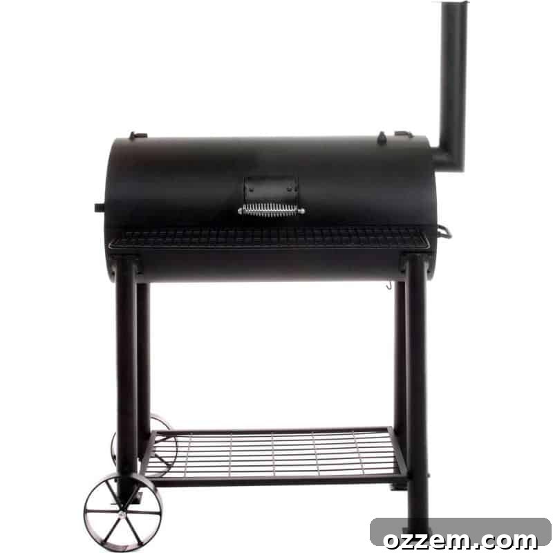 A large barrel-style charcoal grill with an offset smoker box attached to the side, set in a garden.