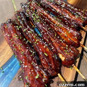 Pork belly skewers glazed and ready to eat