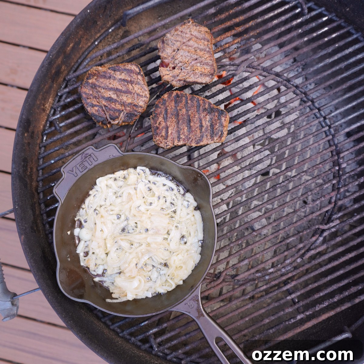 steaks and cast iron skillet on the grill. 