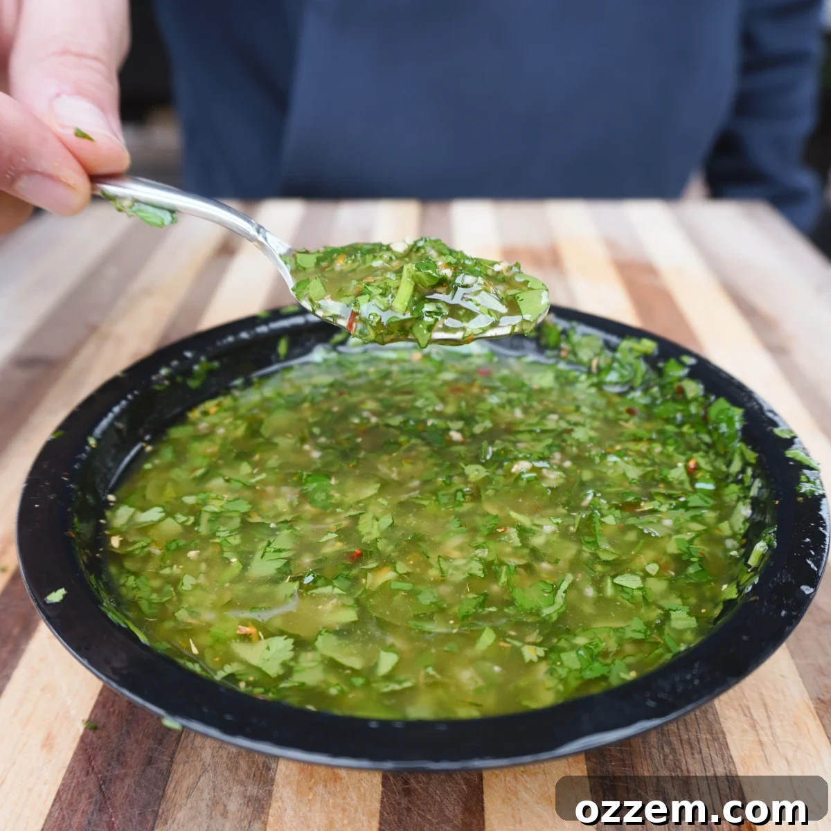 Flame-Kissed Red Snapper 9 Close-up of vibrant zesty chimichurri sauce in a bowl.