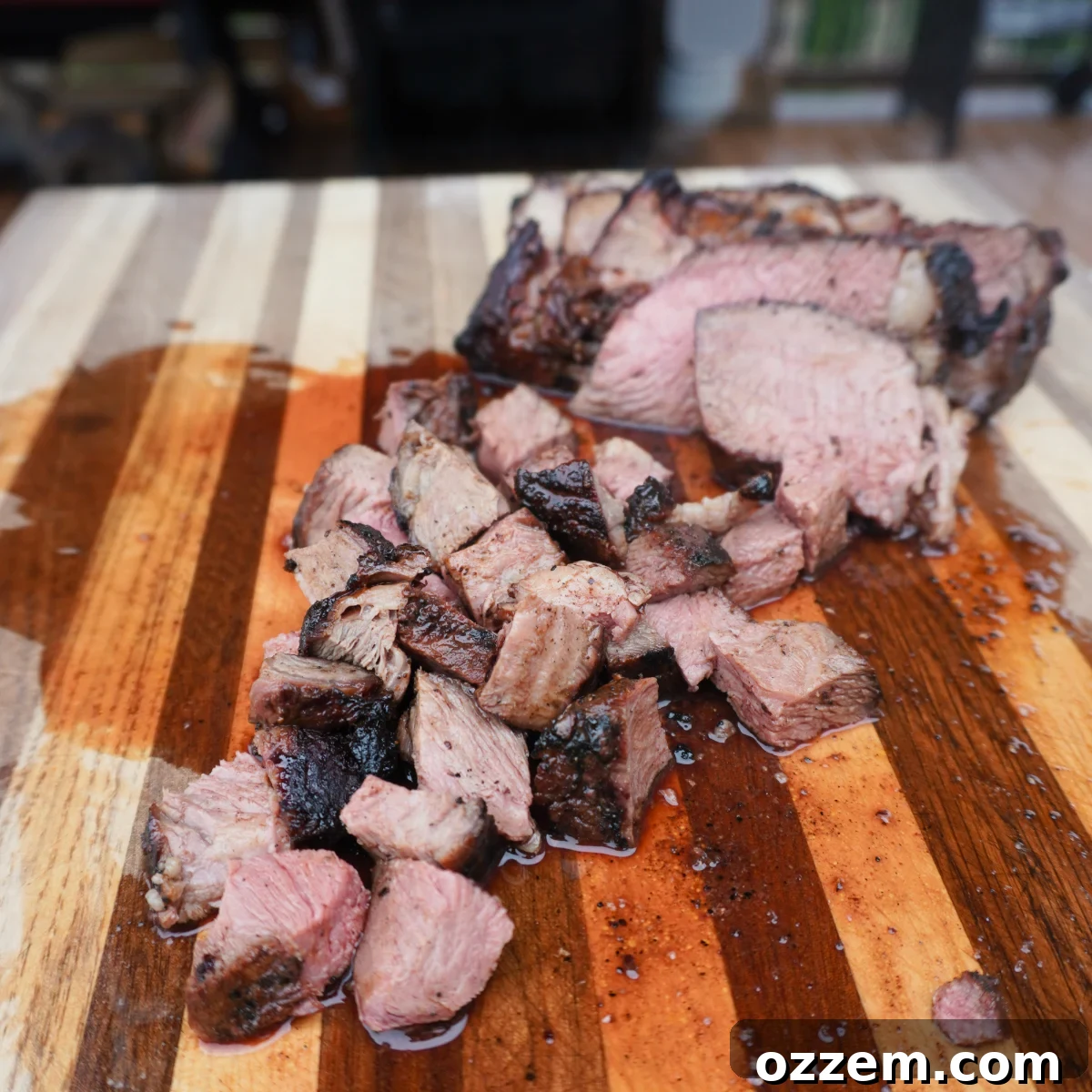 Chopped smoked chuck roast, cubed into bite-sized pieces, arranged neatly on a wooden cutting board.