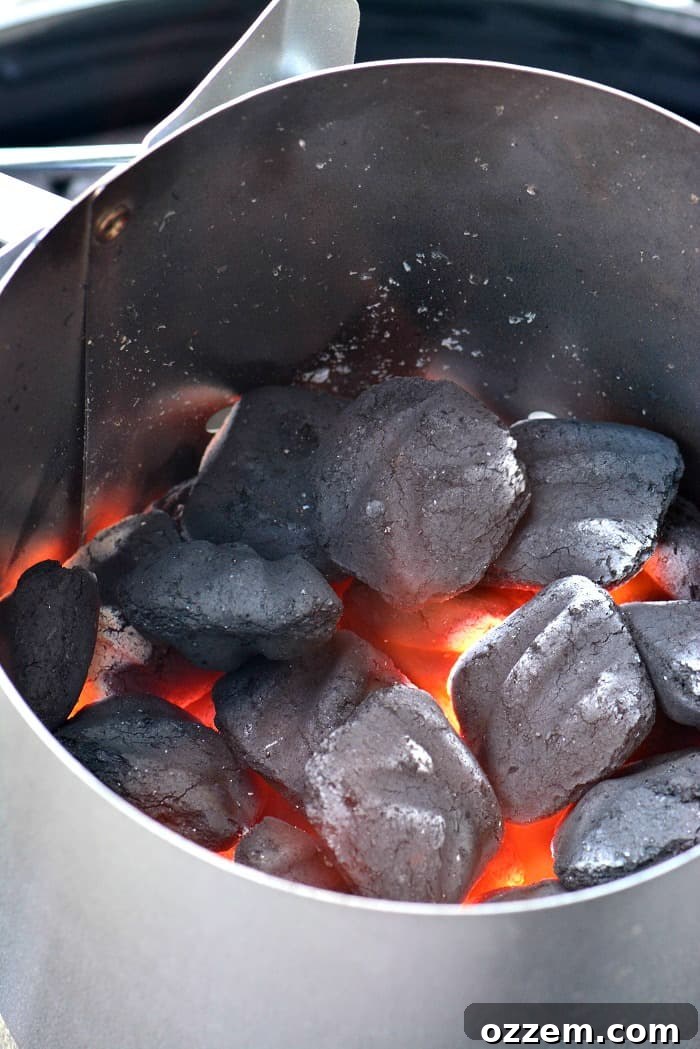 Fuel Your Grill Choosing the Right Charcoal 6 coals lit in the chimney