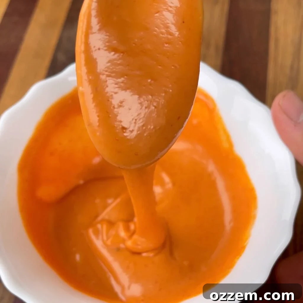 Ingredients for the homemade spicy sauce: ketchup, mayonnaise, and hot sauce.