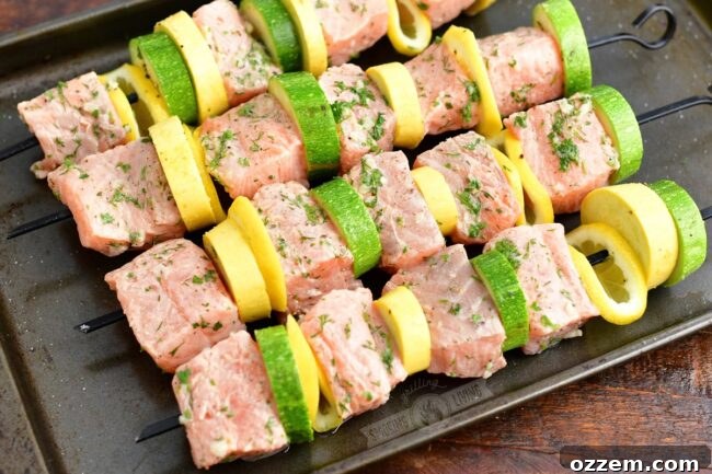 raw salmon and vegetables on skewers