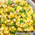 finished grilled corn salad in a white bowl