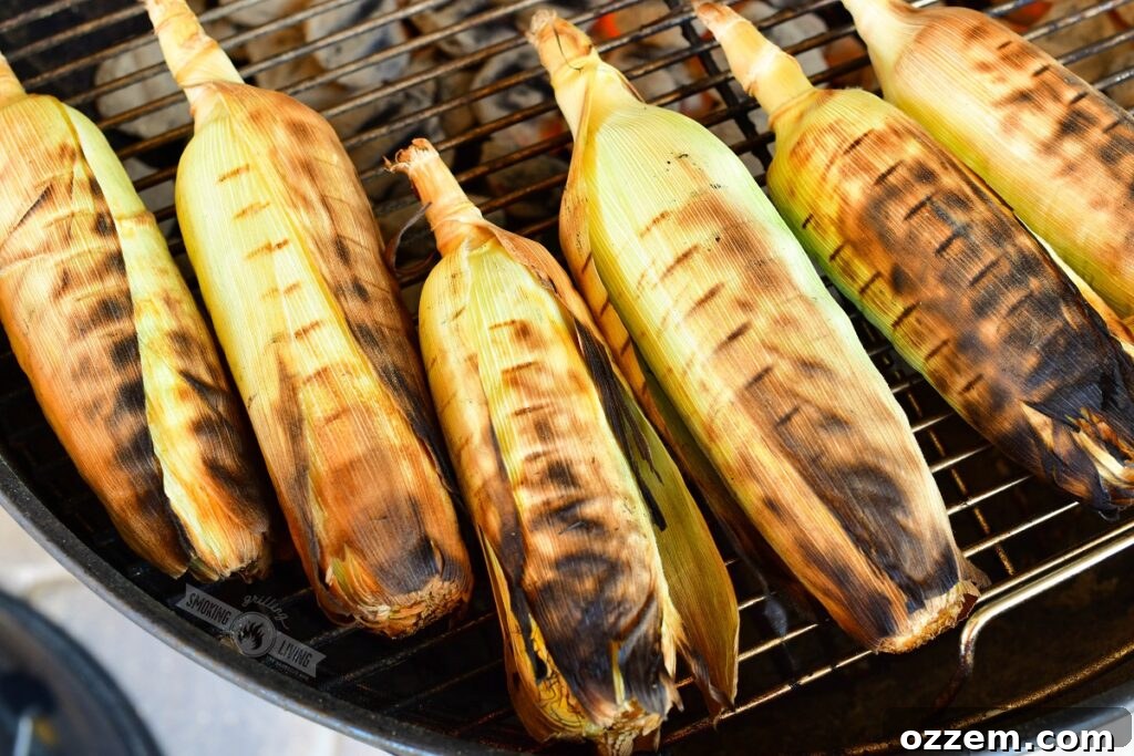 grilled corn in husks on a grill