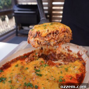 A beautifully smoked enchilada casserole, golden brown and cheesy.