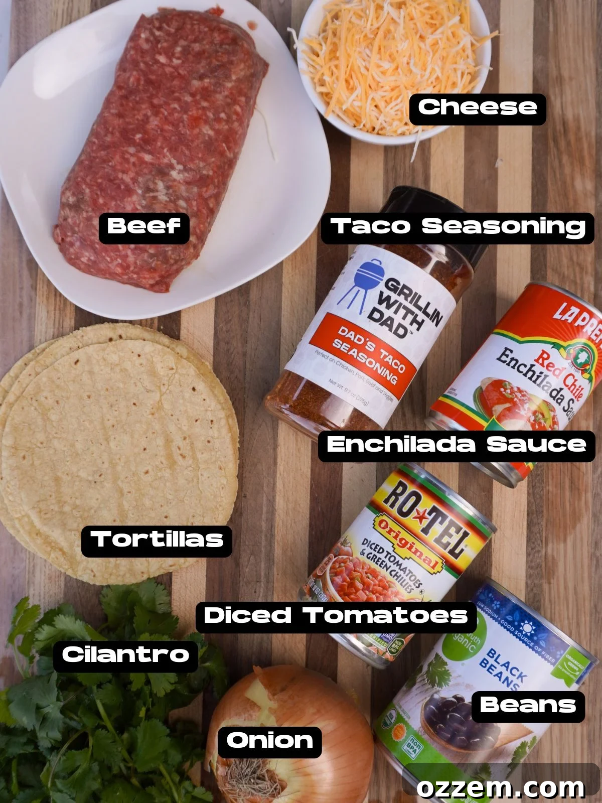 A vibrant display of all the ingredients needed for a Smoked Beef Enchilada Casserole, including ground beef, tortillas, sauces, and cheese.