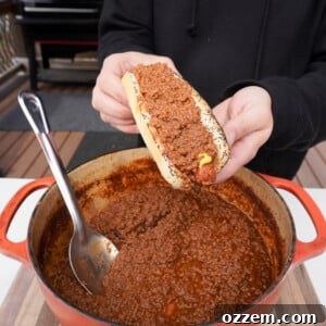Smoked Chili Fire Dog 9 A delicious smoked chili hot dog, garnished with cheese.