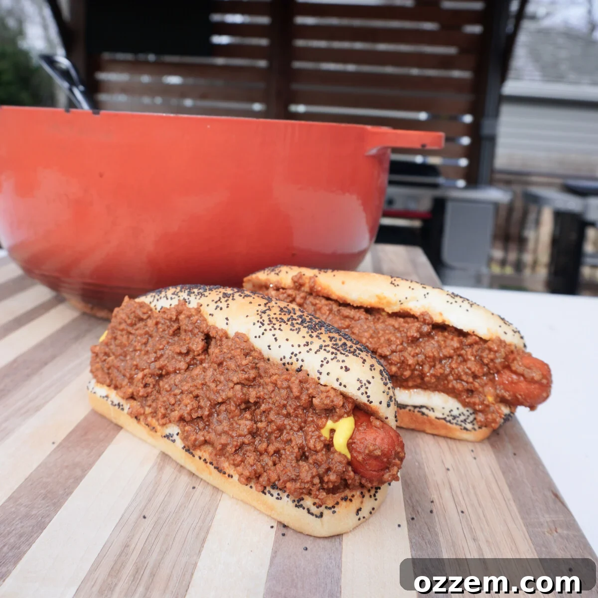 Smoked Chili Fire Dog 8 A homemade smoked chili hot dog with cheese and mustard, ready to eat.