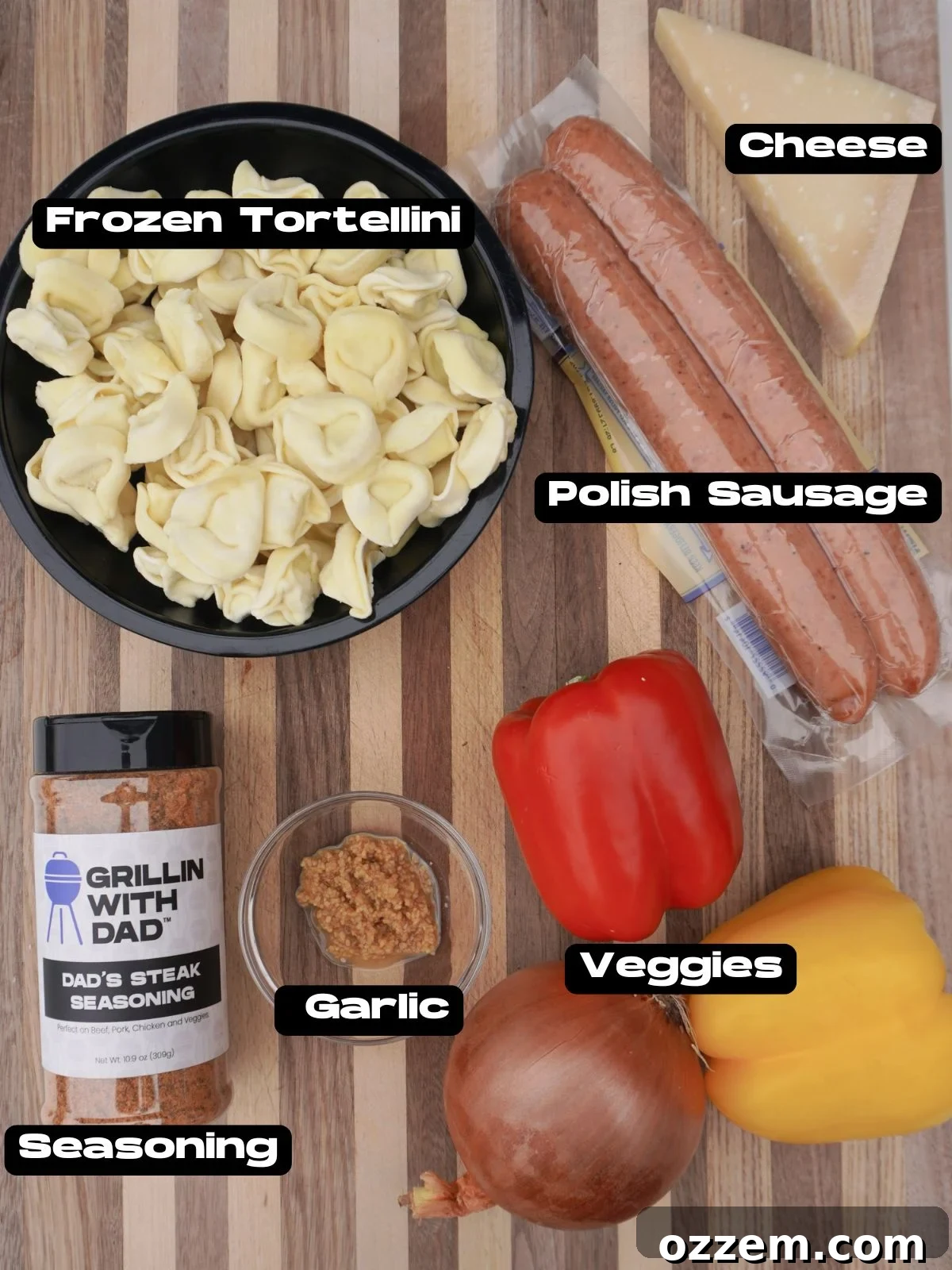 A vibrant selection of ingredients for Grilled Sausage and Tortellini Dinner, including colorful bell peppers, onion, smoked Polish sausage, and frozen tortellini, ready for the griddle.
