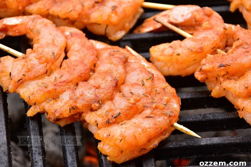 spicy grilled shrimp cooking on the grill grates