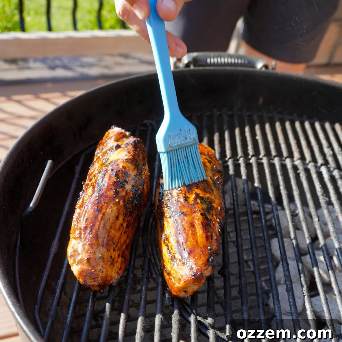Sweet Meets Savory Pork Tenderloin 8 Brushing sweet and savory marinade over grilled pork tenderloin on the indirect heat side of the grill.