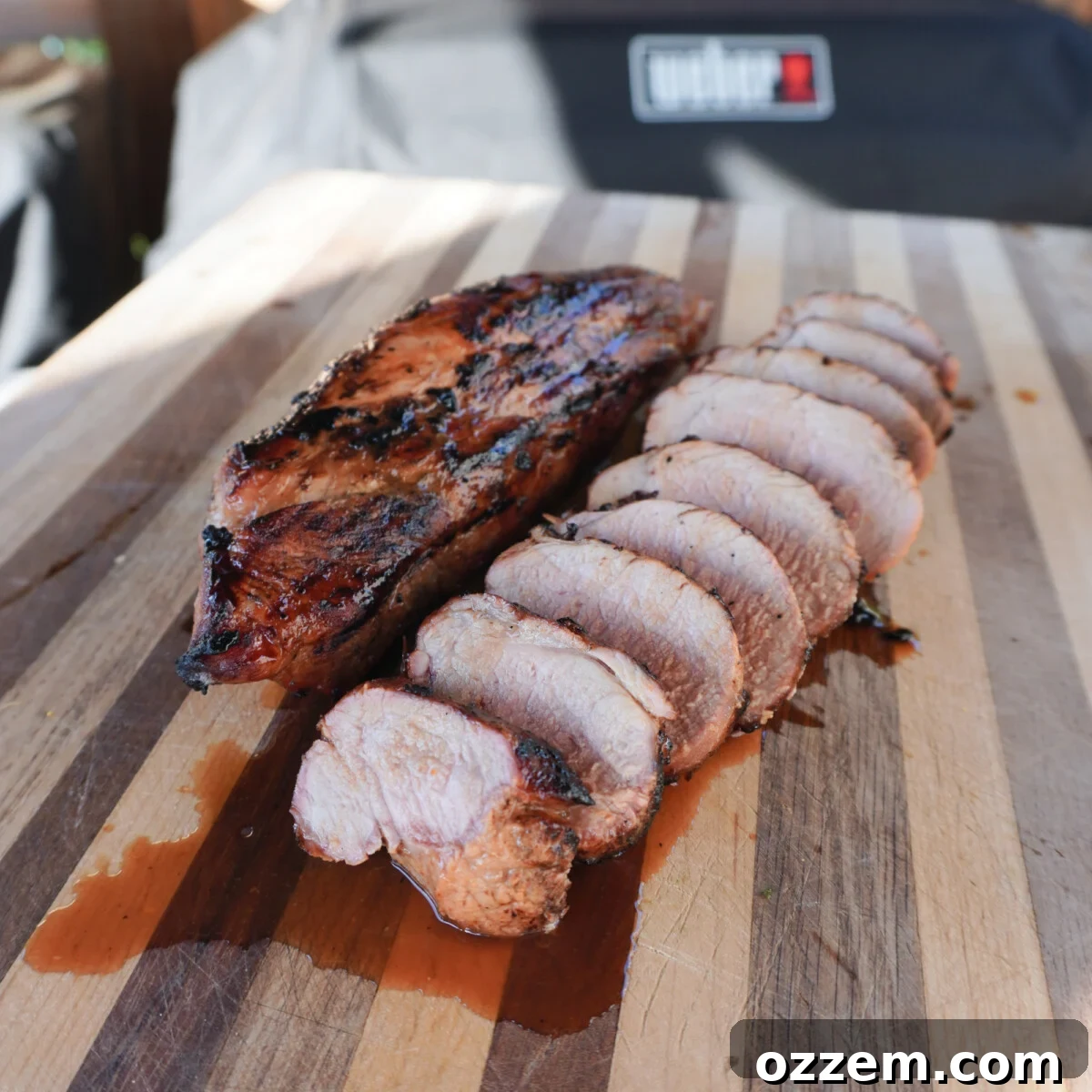 Sweet Meets Savory Pork Tenderloin 9 Sweet and Savory Pork Tenderloin, sliced and garnished, ready for serving.