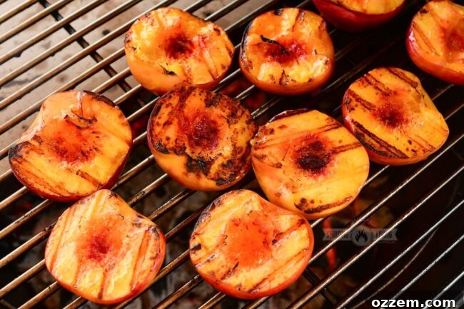 grilled peaches on the grill grate