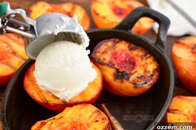 adding scoop of vanilla ice cream of a grilled peach