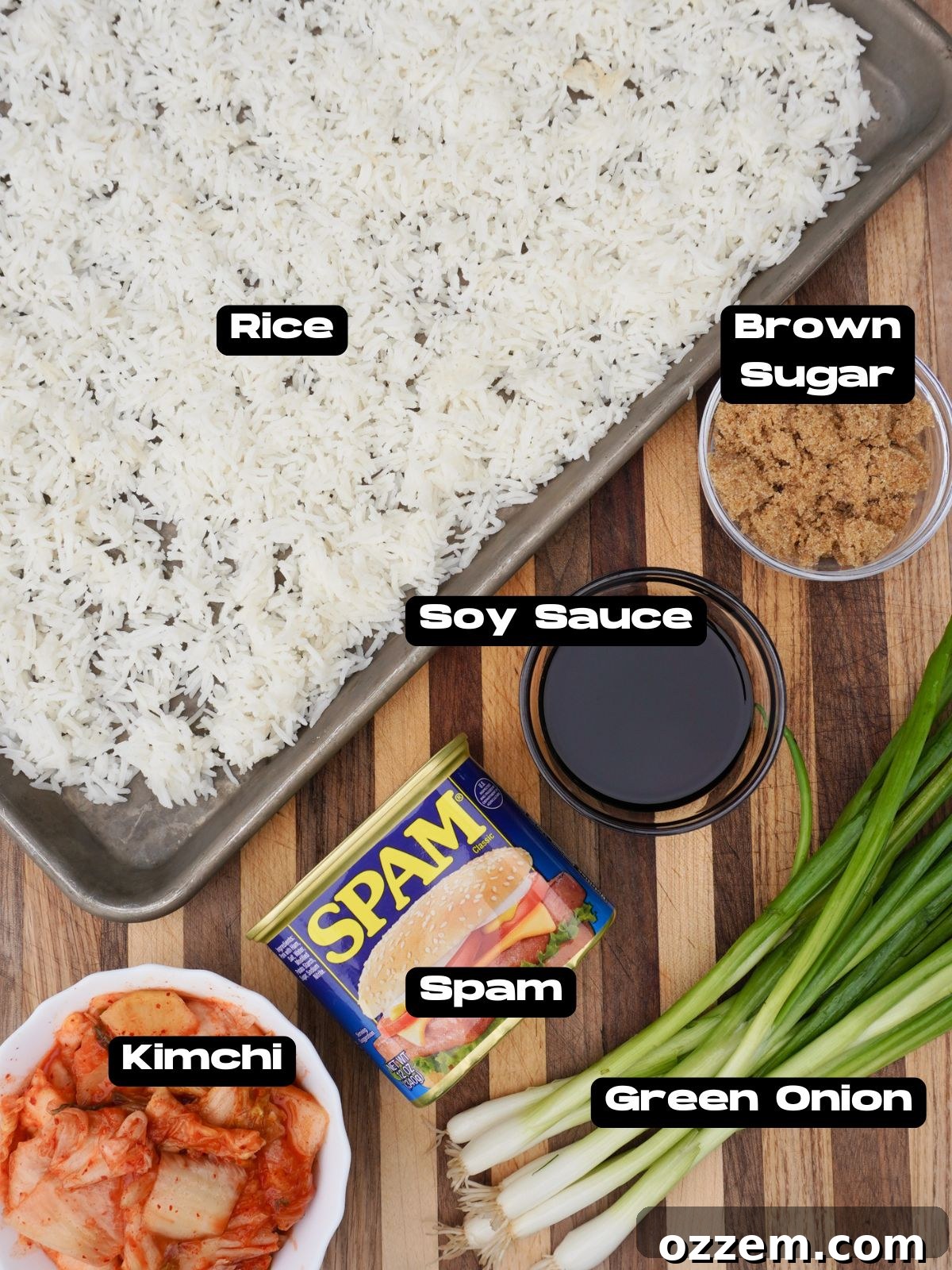 A vibrant selection of ingredients laid out for kimchi fried rice, including rice, kimchi, green onions, and Spam.
