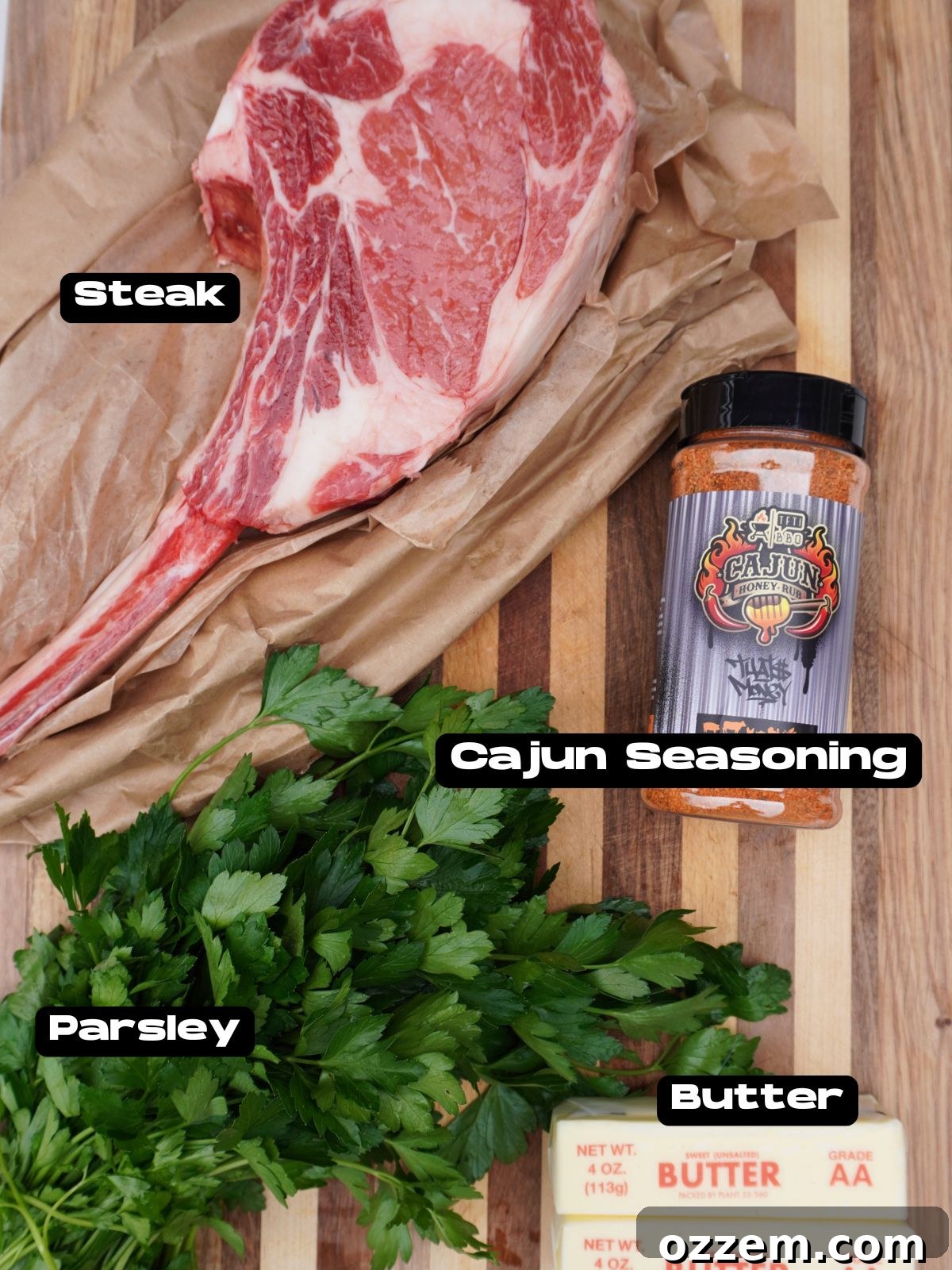 Sizzling Tomahawk with Zesty Cajun Butter 3 All ingredients for Grilled Tomahawk with Cajun Butter laid out including steak, seasoning, butter, and parsley.