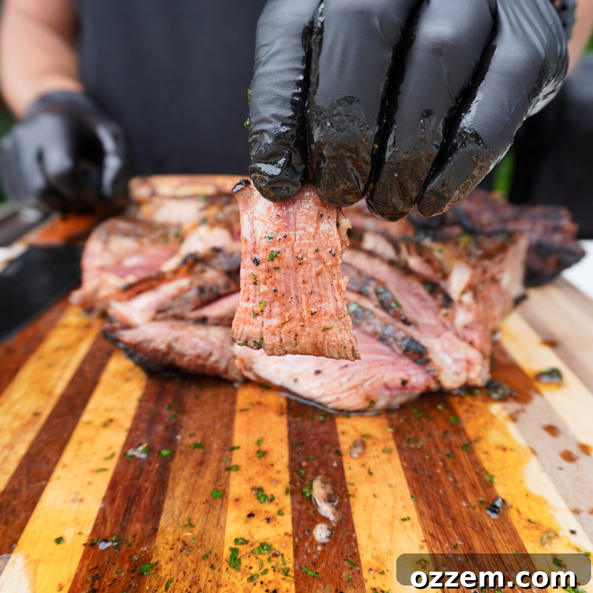 Sizzling Tomahawk with Zesty Cajun Butter 7 A perfectly sliced grilled tomahawk steak, showcasing its medium-rare interior.