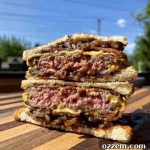 Delicious BBQ Patty Melt sandwich on a cutting board.