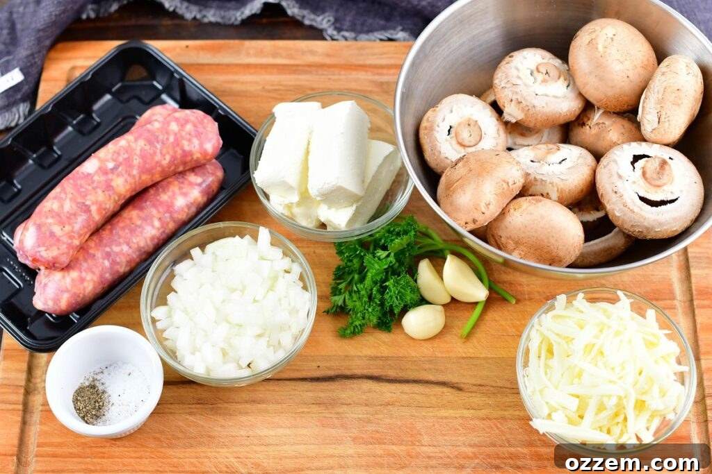 Ingredients for sausage stuffed mushrooms laid out on a wooden cutting board: portabella mushrooms, Italian sausage, cheeses, onions, garlic, and parsley.