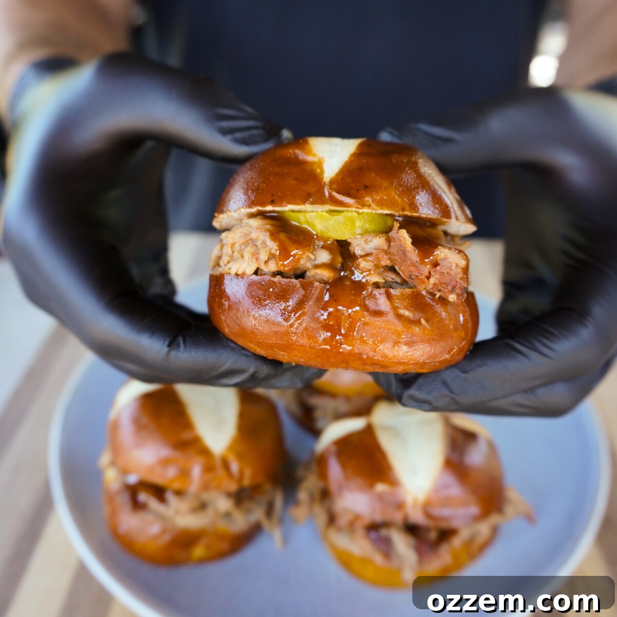 Southern Gold Smoked Pulled Pork 11 A perfectly constructed Smoked Pulled Pork with Mustard BBQ Sauce sandwich on a pretzel bun, ready to be enjoyed.