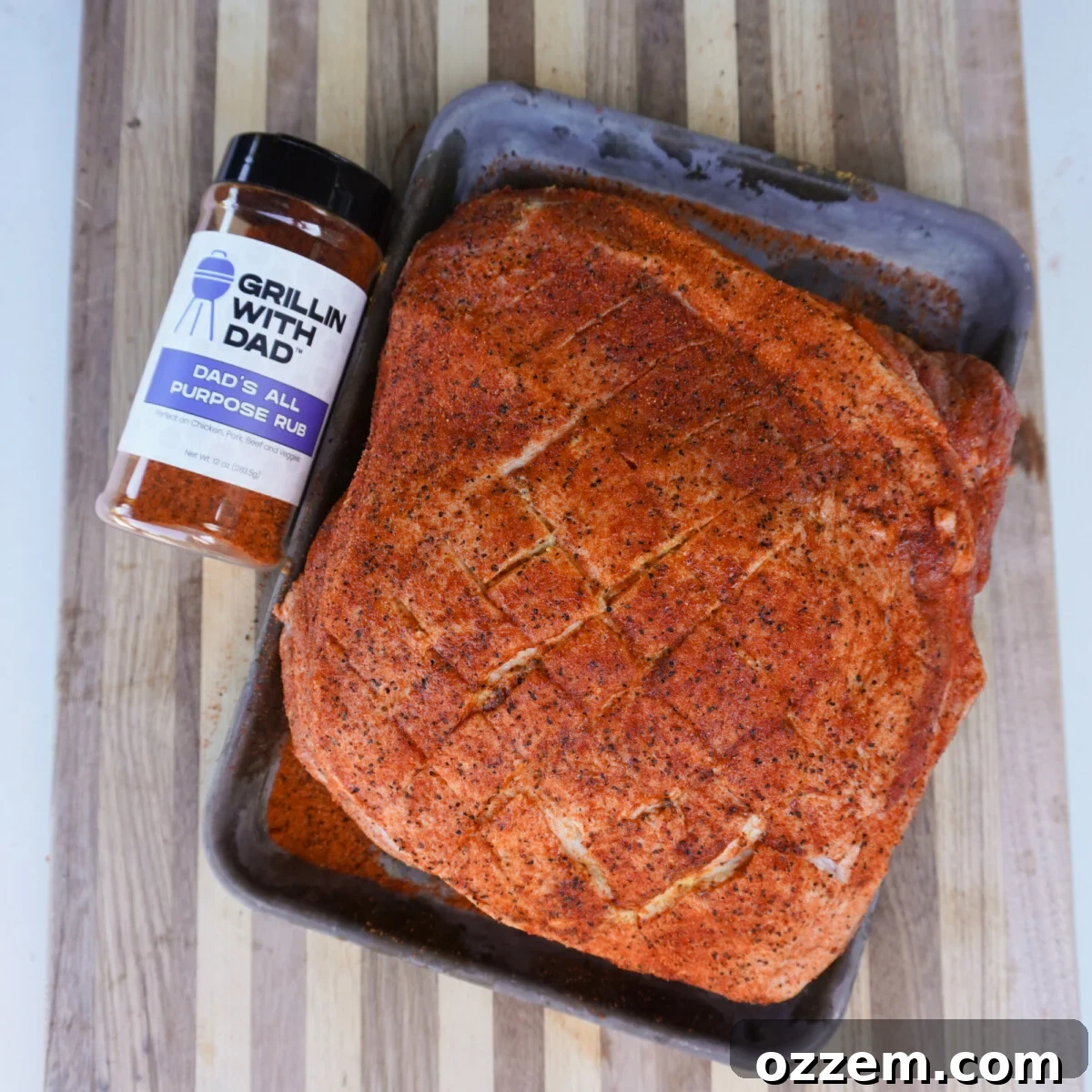 Southern Gold Smoked Pulled Pork 5 A generously seasoned raw pork shoulder resting on a tray, ready for the smoker.