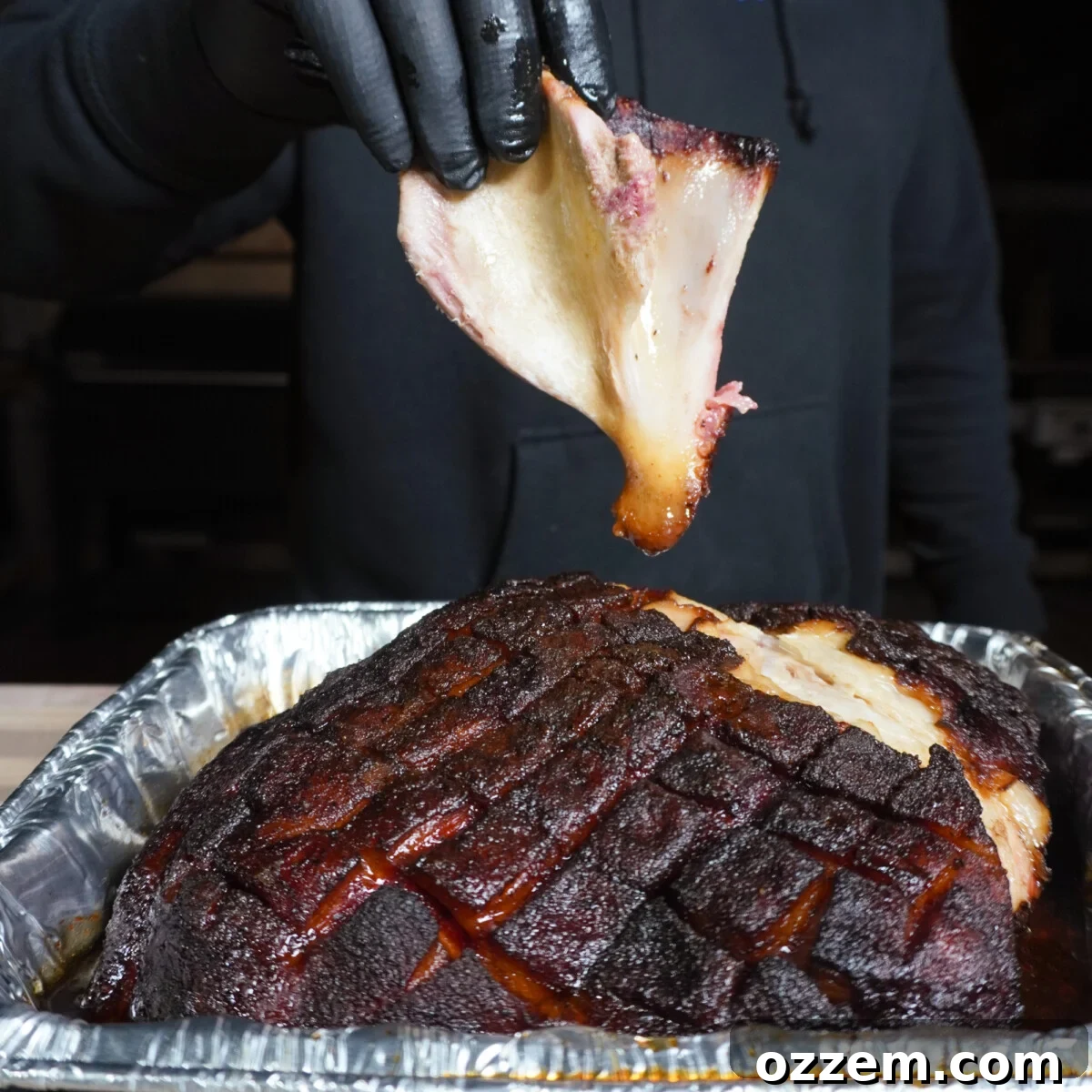Southern Gold Smoked Pulled Pork 9 A perfectly cooked pulled pork shoulder with the bone easily removed, showcasing its tenderness.