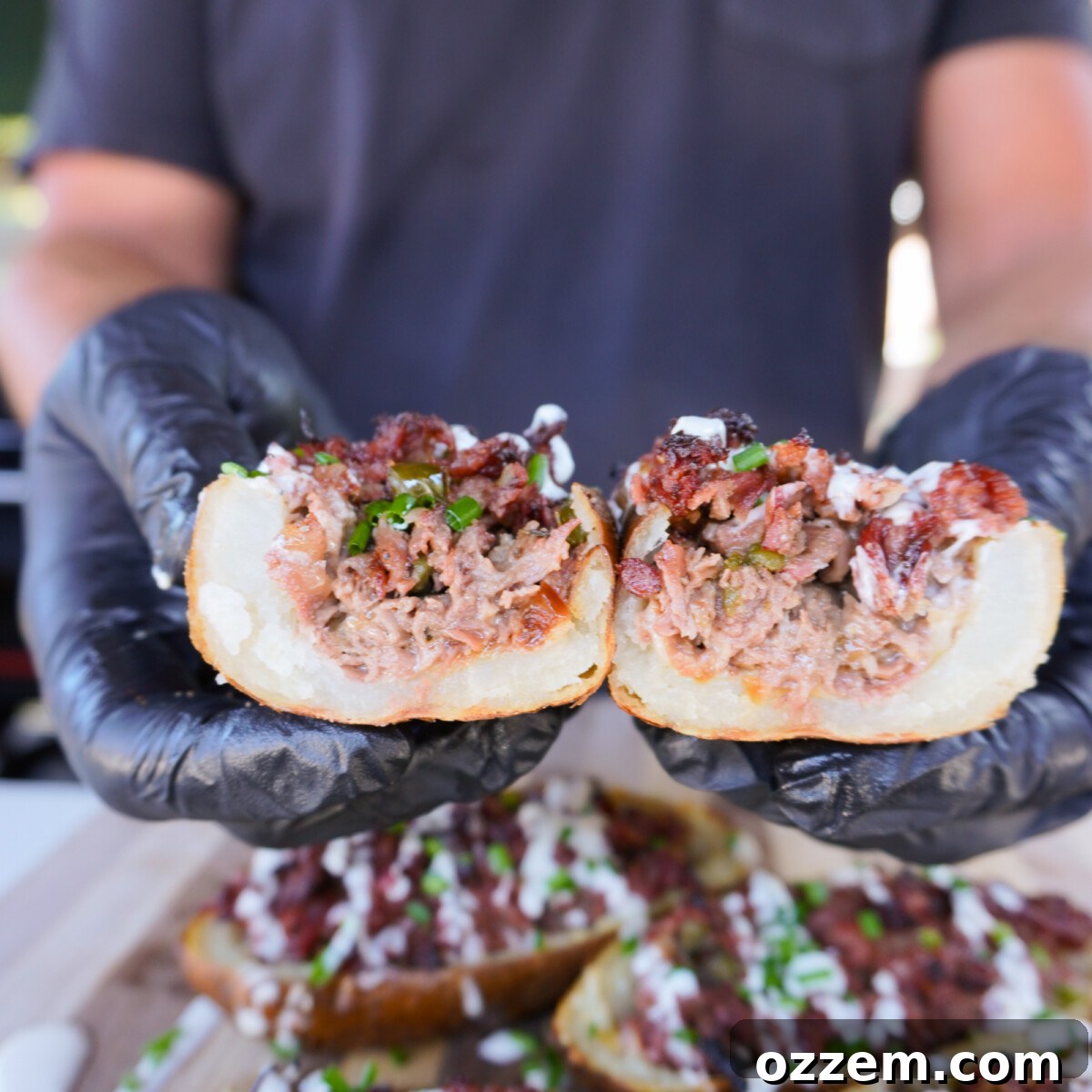 Sliced in half grilled cheesesteak potato skins, showing the rich filling.