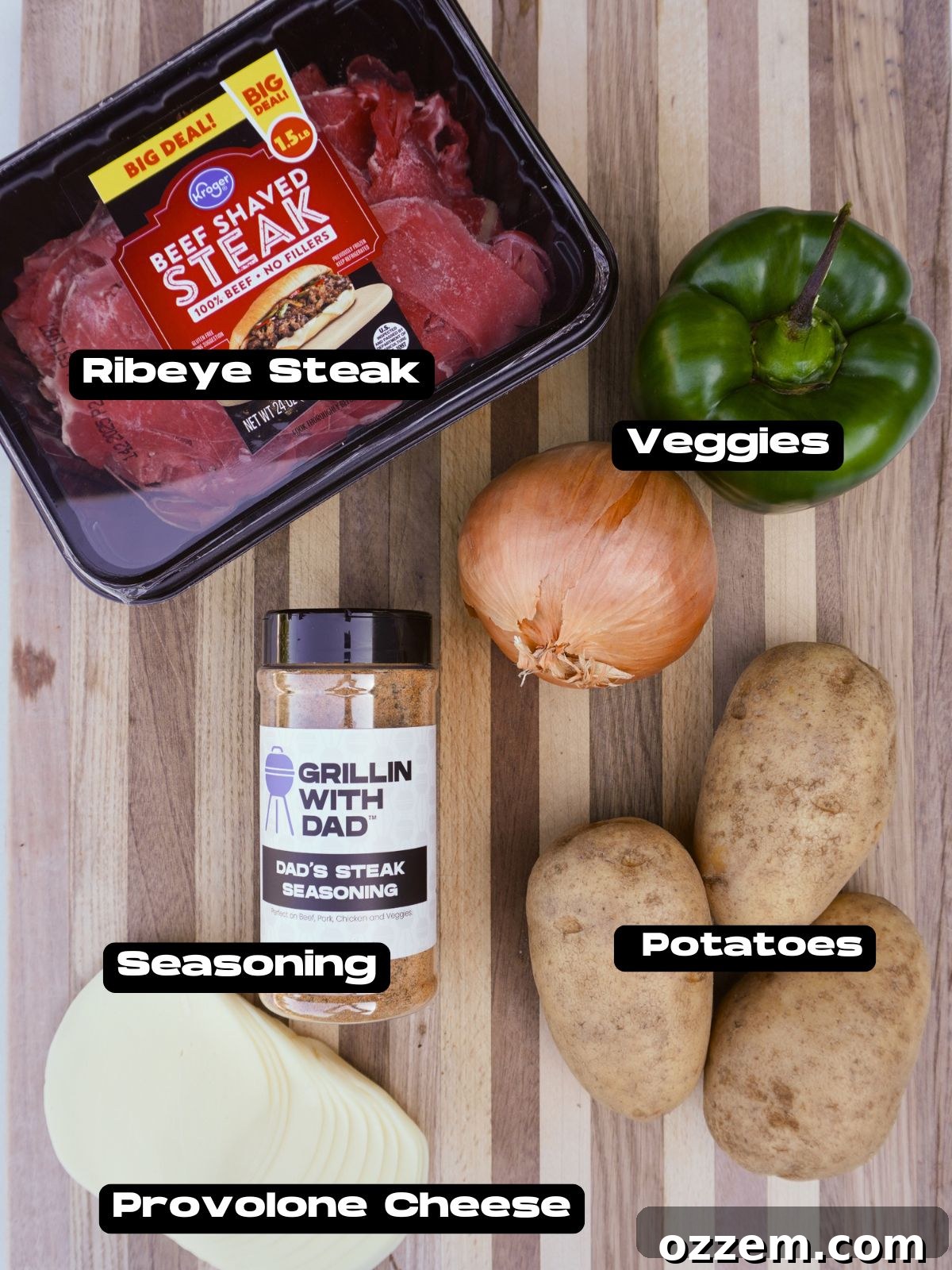 Grilled Cheesesteak Potato Skins ingredients laid out on a table.