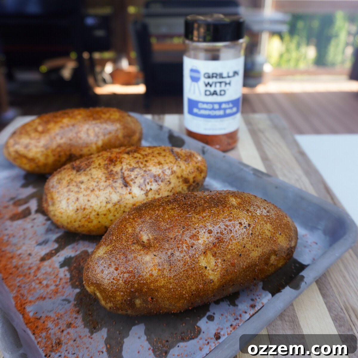 Cleaned and seasoned russet potatoes, ready for grilling.