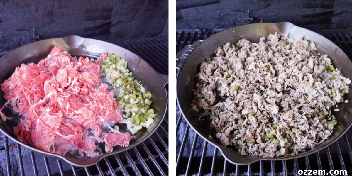 Diced green bell peppers and yellow onions sautéing in a cast iron skillet on a grill.