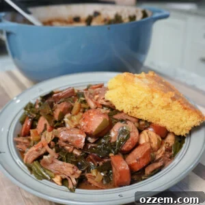 Collard Greens Cajun Gumbo plated with a cornbread wedge and blue pot in the background.