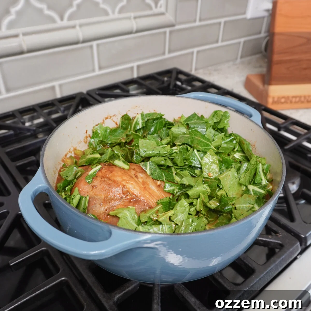 A rich, dark gumbo broth simmering in a Dutch oven.