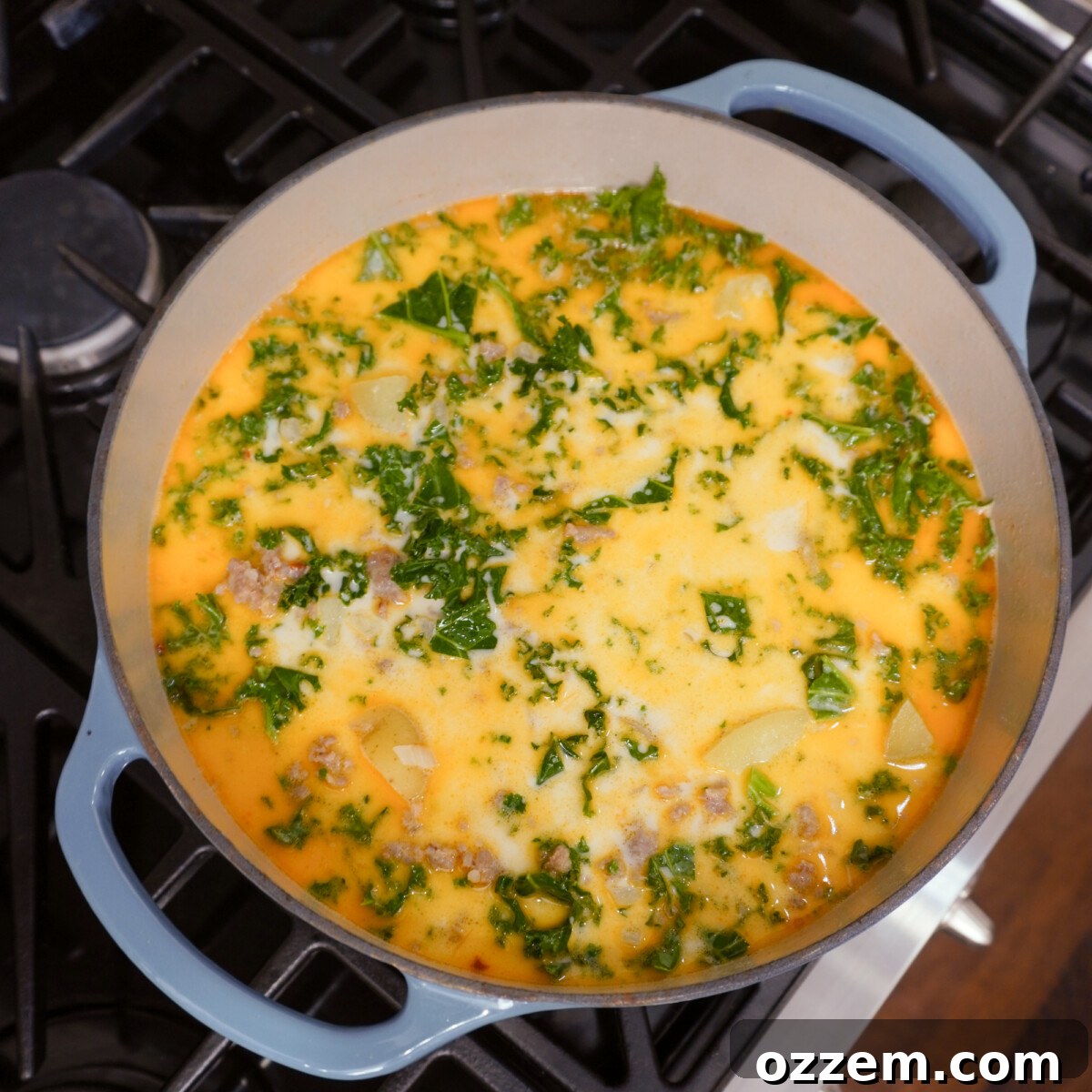 homemade zuppa toscana simmering on the stove top.