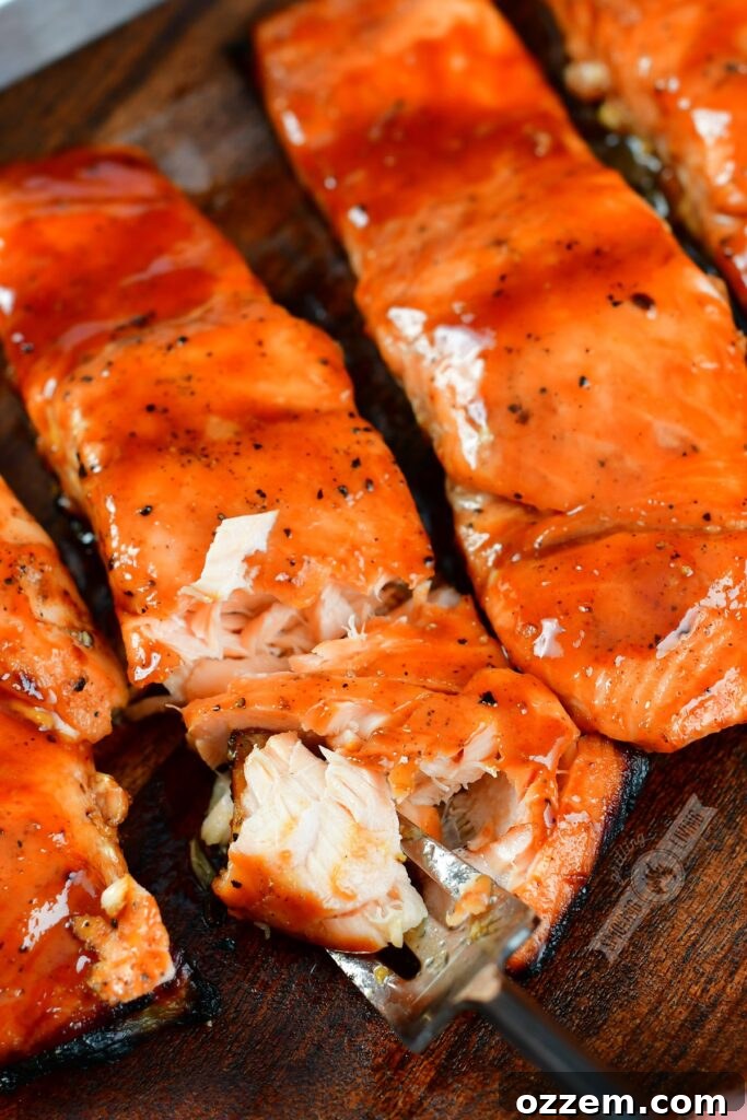 Caramelized Maple BBQ Grilled Salmon 8 Close up of glazed grilled salmon flaking easily with a fork, showing its tenderness