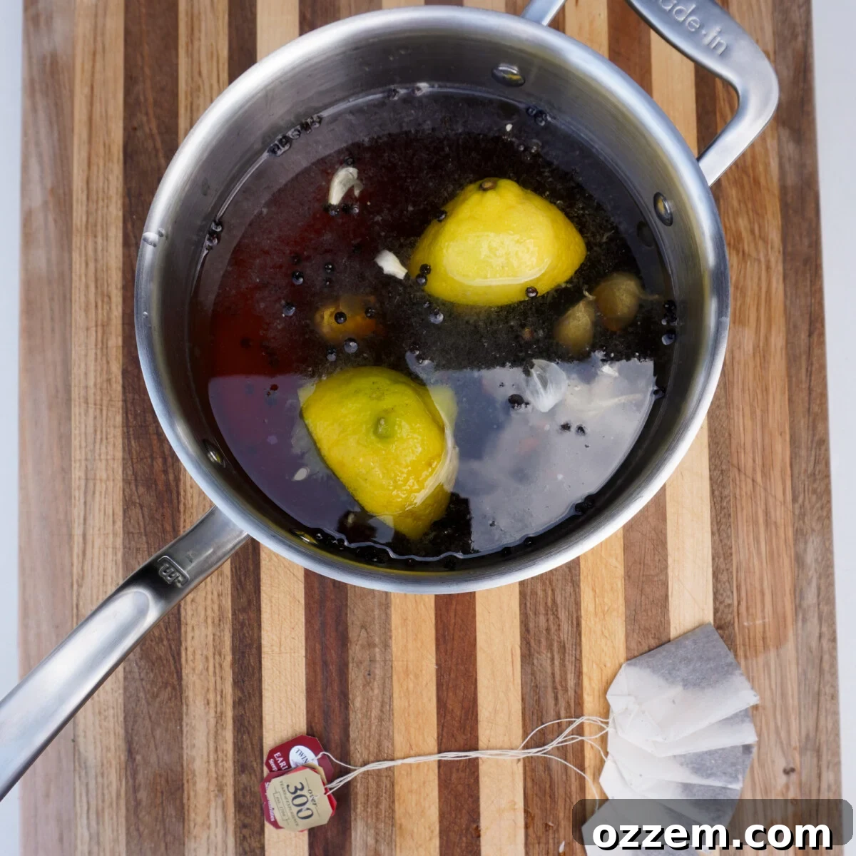 A large pot of sweet tea brine, infused with lemon and peppercorns, ready for the turkey.